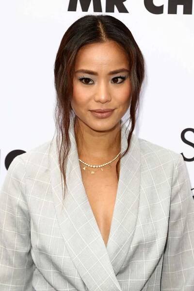 Jamie Chung updo with auburn-tinged tendrils
