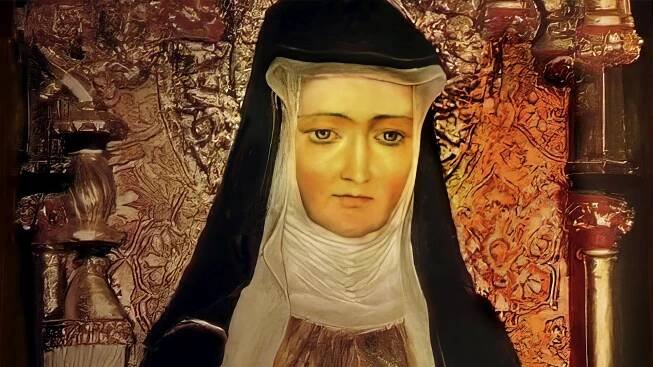 Figur der Hildegard von Bingen, Sibylle vom Rhein, deutsche Benediktineräbtissin und Universalgelehrte. Sie trägt ein schwarzes Kopftuch.