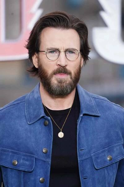 Chris Evans with long hair and a beard