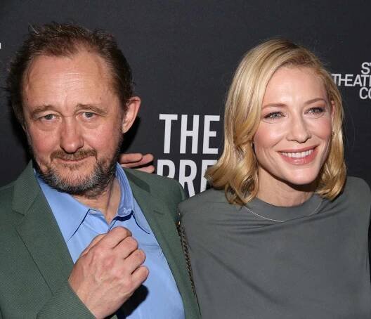 Andrew Upton and Cate Blanchett smiling on the red carpet