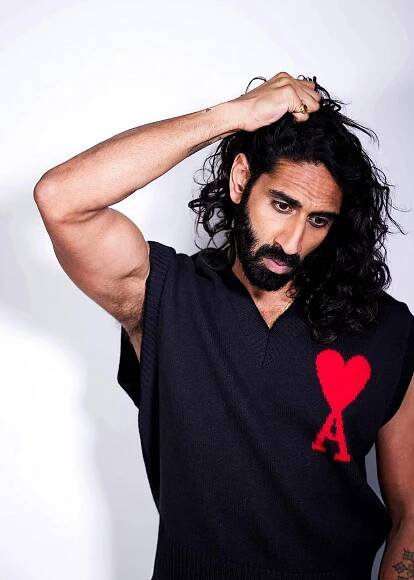 Amar wears knit tank by AMI. 