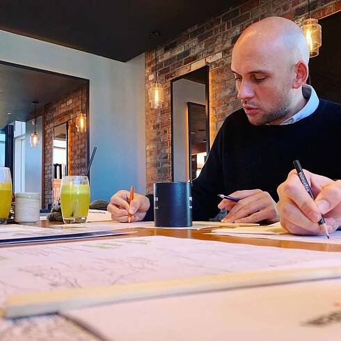 Mike Jordan colouring in the placemat at Wagamama