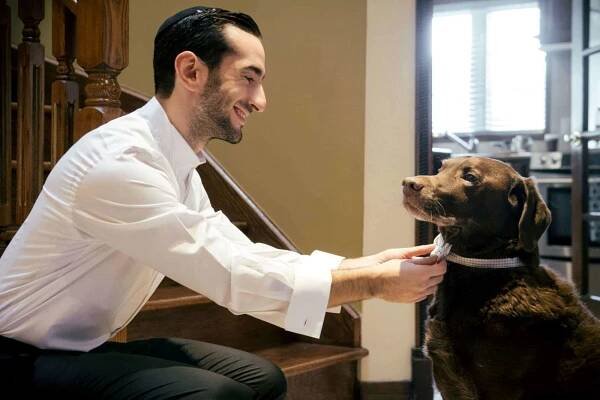 jeremy cohen getting ready dog wedding preparations st-laurent jewish wedding winter white theme bow tie