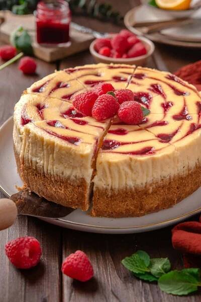 Raspberry cheesecake on a platter.