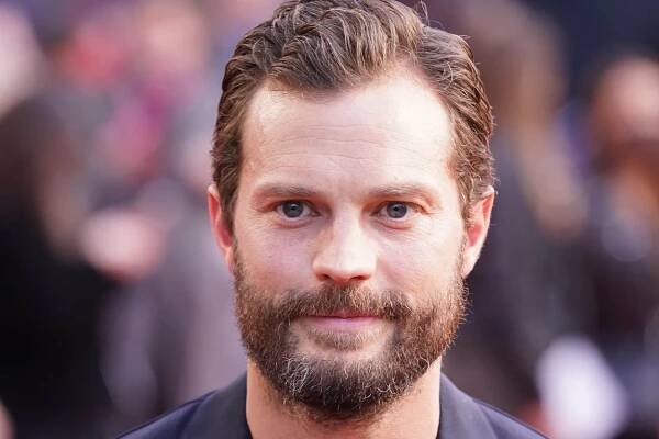 Jamie Dornan said his father was invested in his acting career (Ian West/PA)