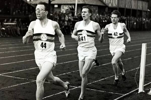 Roger Bannister, centre, on his way to running the first four-minute mile on May 6 1954.