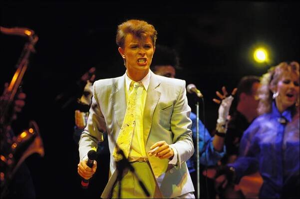 David Bowie performing on stage at Live Aid.