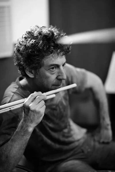 Black and White Photo of Simon Phillips holding drum sticks in 2000s