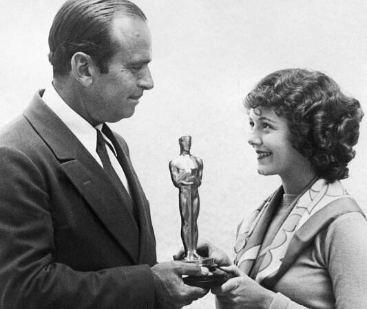 Janet Gaynor, the only woman to win Best Actress for multiple roles, receives her award from Douglas Fairbanks