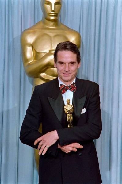 Jeremy Irons holds his Best Actor Oscar for 'Reversal of Fortune' in the press room during the 63rd annual Academy Award on March 25, 1991