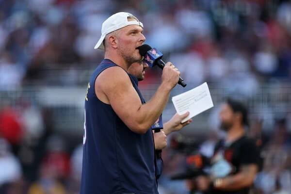 Pat McAfee speaking into a microphone at the Home Run Derby.