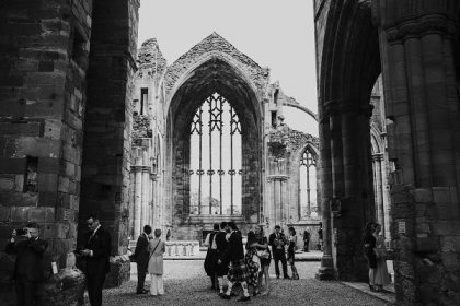 guests arriving for ceremony at melrose Abbey