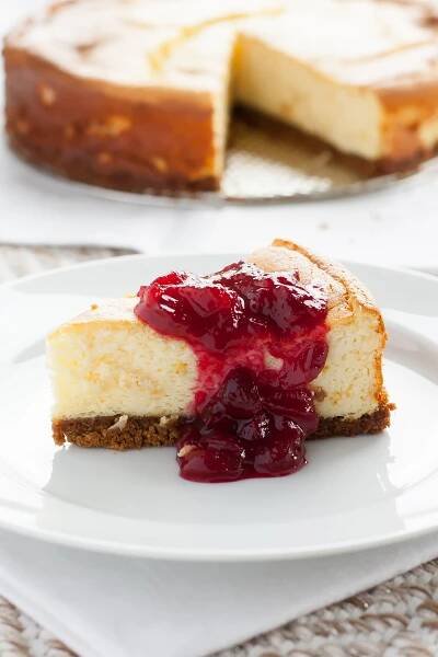 Ricotta Cheesecake with Ginger Snap-Pistachio Crust and Cranberry-Orange Sauce