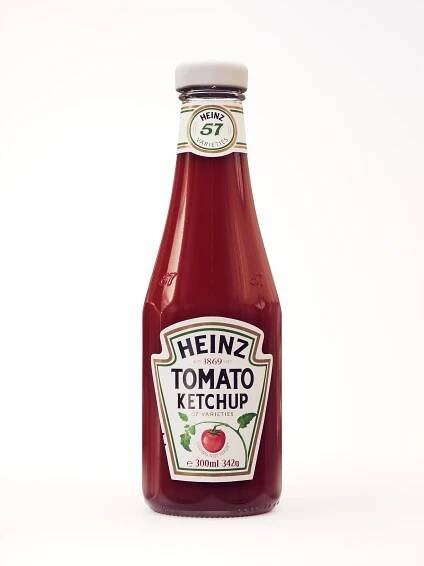 a bottle of heinz's tomato ketchup on a white background