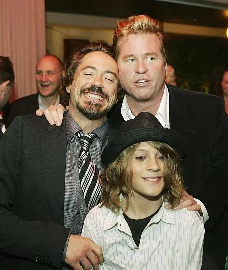 Actors Robert Downey Jr., his son Indio (L) and Val Kilmer pose at the afterparty for the premiere of Warner Bros. Picture's 