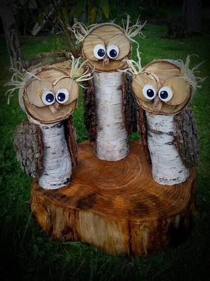 three wooden logs with fake eyes on them
