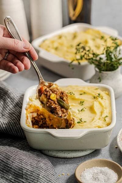 Guinness shepherd's pie being served from a baking dish.