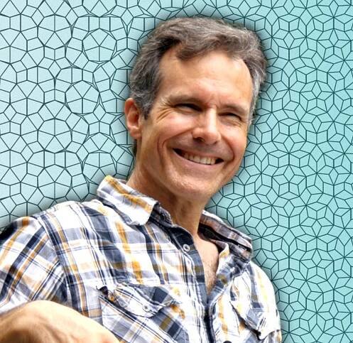 Portrait of Dr. Eric Smith with a geometric background
