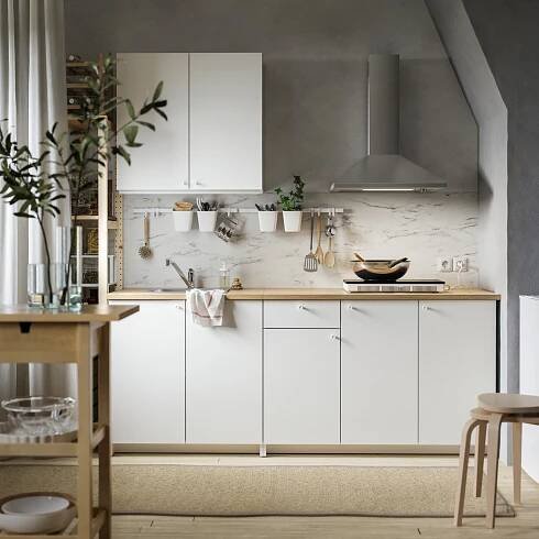 KNOXHULT kitchen system in white and brown minimal colours and style.