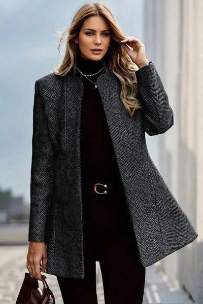 Black turtleneck, slim trousers, heeled boots.