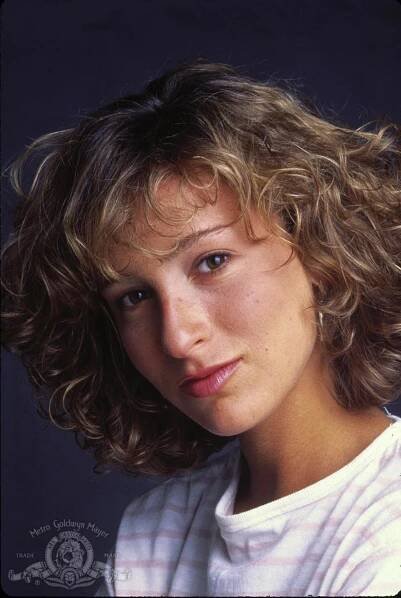 a close up of a person with curly hair