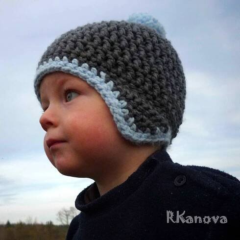 a small child wearing a crocheted hat