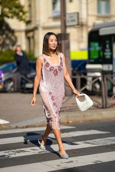 Person wearing a sparkly light purple tea-length cocktail dress