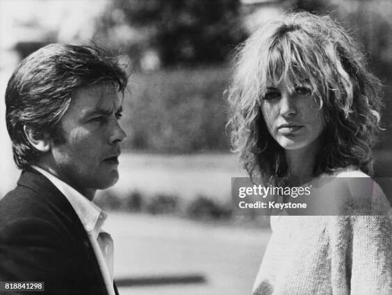 French actor Alain Delon and Italian actress Dalila Di Lazzaro on the set of the film 'Trois hommes à abattre', , France, 8th October 1980.