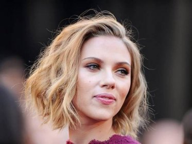 Scarlett Johansson sets pulses racing as she showcases her incredible physique in tight blue dress