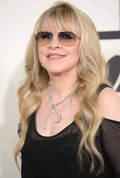 Stevie Nicks wears aviator sunglasses