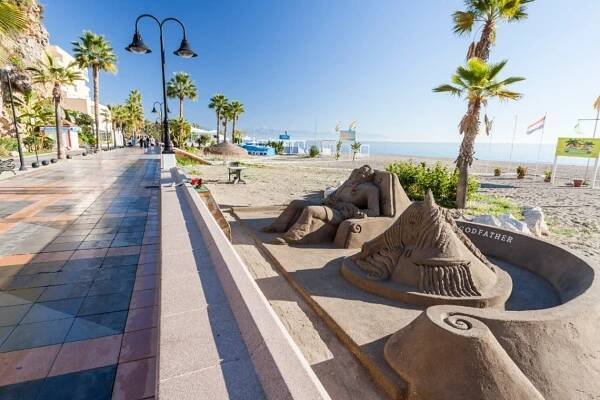 a sand sculpture with the word godfather on it