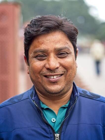 Guide at the Taj Mahal, Agra, India by Sam Davis Professional Travel Portrait Photographer