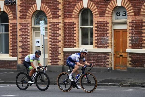 GEELONG AUSTRALIA  JANUARY 29 LR Elliot Schultz of Australia and Australian National Team and Dries Devenyns of Belgium and Team Soudal QuickStep compete in the breakaway during the 7th Cadel Evans Great Ocean Road Race 2023  Mens Elite a 1743km one day race from Geelong to Geelong  CadelRoadRace  on January 29 2023 in Geelong Australia Photo by Tim de WaeleGetty Images