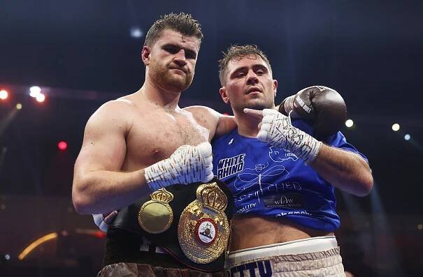 Johnny Fisher with his belt after a boxing victory.