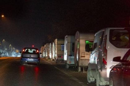 The caravans are situated right next to busy roads where cars and trucks will pass by