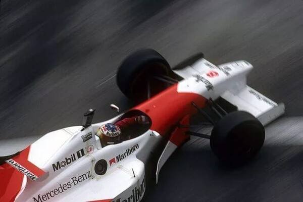 David Coulthard racing with Michael Schumacher's helmet in 1996