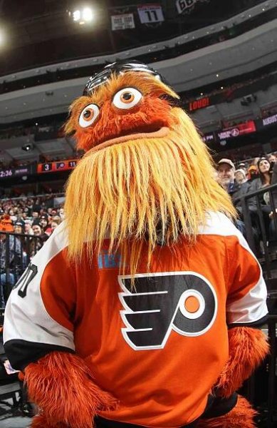 Gritty the mascot of the Philadelphia Flyers entertains the crowd during an NHL game against the New Jersey Devils