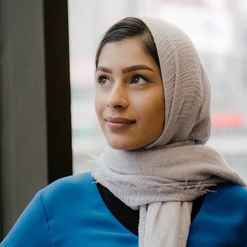 Portrait of Atika Ismail, marketing student, looking to the left. 
