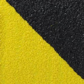 Černo-žlutá korundová protiskluzová páska pro nerovné povrchy FLOMA Hazard Conformable - délka 18,3 m, šířka 5 cm a tloušťka 1,1 mm