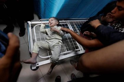Palestinian children wounded in Israeli strikes wait to receive treatment at Nasser hospital in Khan Younis