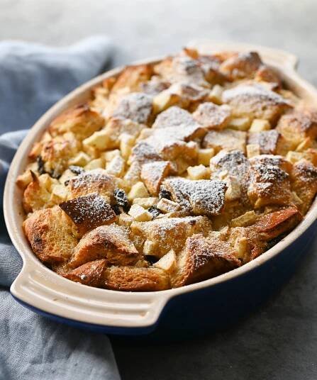 Dish of apple rum raising bread pudding.