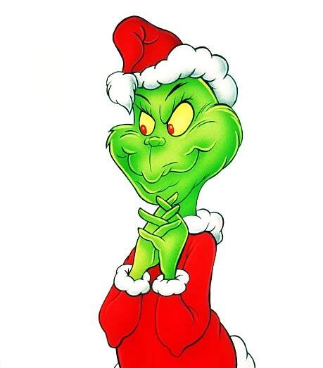 The Grinch, in a Santa outfit, clasps his hands with a mischievous expression