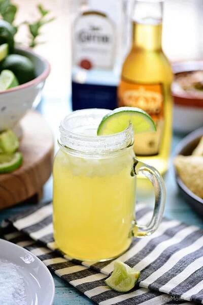This easy recipe for a Beer Margarita has only 3 ingredients and is dripping with Mexican flavors. The best Beergarita is light, not too sweet, refreshing and super easy, to make! When you combine tequila, beer, and frozen limeade, you have something for the cocktail lover and brewski lover. Perfect for Cinco de Mayo or any celebration! Get this #cocktailrecipe at TidyMom.net #margarita #cocktails