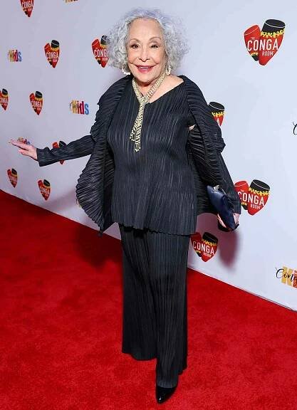 Renée Victor posing on a red carpet