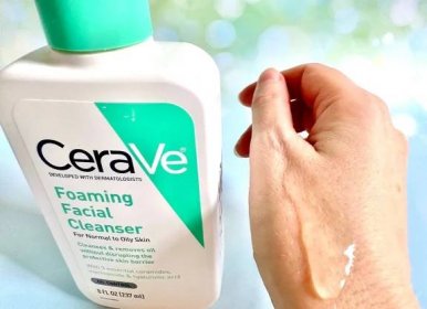 CeraVe Foaming Facial Cleanser bottle next to gel sample on back of hand.