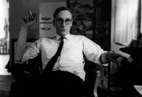 William S. Burroughs in chair