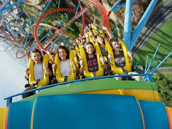 Group of friends on a roller coaster ride at PortAventura Theme Park near Ponient Vila Centric