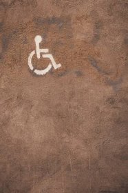 a handicap sign is painted on the ground