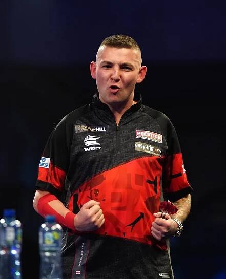 Nathan Aspinall in action against Joe Murnan during day eight of the William Hill World Darts Championship at Alexandra Palace, London. Picture date: Wednesday December 22, 2021. PA Photo. See PA story DARTS World. Photo credit should read: Zac Goodwin/PA Wire. RESTRICTIONS: Use subject to restrictions. Editorial use only, no commercial use without prior consent from rights holder.