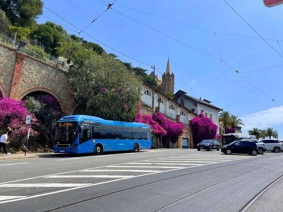 A blue TibiBus parked outside of the Tibidabo funicular station in Barcelona, Spain